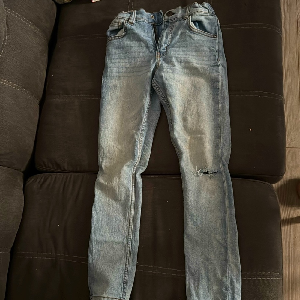 Light blue wash skinny denim. Distressed. Size 8